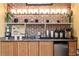 Well-stocked coffee bar featuring a brick wall, mini fridge, and coffee machines for residents' enjoyment at 911 N Orange Ave # 440, Orlando, FL 32801