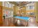Spacious game room with a pool table, high ceilings, and plenty of natural light at 911 N Orange Ave # 440, Orlando, FL 32801