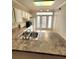 Bright kitchen with white appliances and ample countertop space, complemented by tile floors and natural light at 911 N Orange Ave # 440, Orlando, FL 32801