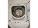 Efficient white stacked washer and dryer with clearly labeled controls, ideal for convenient laundry solutions at 911 N Orange Ave # 440, Orlando, FL 32801
