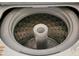Inside view of top load washing machine featuring a durable drum and central agitator for efficient cleaning at 911 N Orange Ave # 440, Orlando, FL 32801