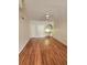 Bright living room boasts hardwood floors, a ceiling fan, and a built-in desk, creating a functional and inviting space at 911 N Orange Ave # 440, Orlando, FL 32801