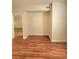 Spacious living room boasts hardwood floors and neutral paint, creating a bright and inviting space at 911 N Orange Ave # 440, Orlando, FL 32801