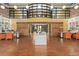 Welcoming lobby featuring wood floors, high ceilings, decorative lighting, and dual work stations, ideal for guests at 911 N Orange Ave # 440, Orlando, FL 32801