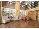 Bright lobby with comfortable seating, built-in bookshelves, natural light, and wood floors create inviting space at 911 N Orange Ave # 440, Orlando, FL 32801