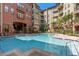 Inviting in-ground pool featuring a multi-level design with a brick-paved surrounding at 911 N Orange Ave # 440, Orlando, FL 32801