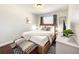 Inviting bedroom featuring a comfortable bed, stylish furnishings, and lots of natural light at 10360 Crystal Point Dr, Orlando, FL 32825