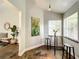 Sunlit breakfast nook with bar seating, views to the dining and living room and accent wall at 10360 Crystal Point Dr, Orlando, FL 32825