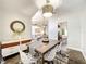 Bright dining room features modern light fixture and decor, connecting to the living room at 10360 Crystal Point Dr, Orlando, FL 32825
