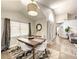 Open dining area with vaulted ceilings, large windows and sliding glass door at 10360 Crystal Point Dr, Orlando, FL 32825