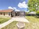The rear of the home features a screened-in pool and outdoor area at 10360 Crystal Point Dr, Orlando, FL 32825