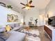 Inviting living area featuring stylish decor, vaulted ceiling, and a comfortable sofa at 10360 Crystal Point Dr, Orlando, FL 32825