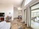 Bright living room featuring slate floors, modern decor, and access to the pool at 10360 Crystal Point Dr, Orlando, FL 32825