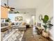 Spacious living room featuring high ceilings, stylish decor, and a comfortable gray sectional sofa at 10360 Crystal Point Dr, Orlando, FL 32825