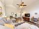 Open living space with modern decor, vaulted ceiling, and comfortable grey sofa at 10360 Crystal Point Dr, Orlando, FL 32825