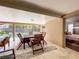 The covered outdoor patio has dining and access to the pool with views of the yard at 10360 Crystal Point Dr, Orlando, FL 32825