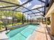 The spacious screened-in pool includes a spa at 10360 Crystal Point Dr, Orlando, FL 32825