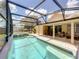 View of the screened-in pool and patio at 10360 Crystal Point Dr, Orlando, FL 32825