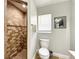 Bathroom featuring a tiled shower with a decorative accent row and a tiled floor at 10360 Crystal Point Dr, Orlando, FL 32825