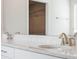 Close up on a bathroom vanity with a marble countertop and undermount sink and nickel faucet at 11027 Hollow Bay Dr, Winter Garden, FL 34787