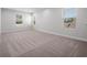 Spacious bedroom featuring large windows that provide ample natural light at 11027 Hollow Bay Dr, Winter Garden, FL 34787