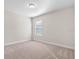 Bedroom with neutral carpet and a window with blinds and a ceiling light at 11027 Hollow Bay Dr, Winter Garden, FL 34787