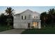 Charming two-story home features a two-car garage and well-manicured landscaping at 11027 Hollow Bay Dr, Winter Garden, FL 34787
