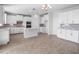 Modern kitchen featuring white cabinets, granite countertops, tile backsplash, and stainless steel appliances at 11027 Hollow Bay Dr, Winter Garden, FL 34787
