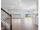 Open-concept living area with tile floors and abundant natural light from the sliding glass door at 11027 Hollow Bay Dr, Winter Garden, FL 34787