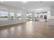 Spacious open-concept living area with tile floors and lake views at 11027 Hollow Bay Dr, Winter Garden, FL 34787
