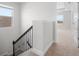 Well-lit staircase leading to the upper level, featuring white walls and plush carpeting at 11027 Hollow Bay Dr, Winter Garden, FL 34787