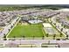 Aerial view of a large community park, playground, and basketball court at 11288 Listening Dr, Orlando, FL 32832