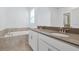 Bathroom featuring a double sink vanity, large bathtub, and tile flooring at 11288 Listening Dr, Orlando, FL 32832
