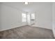 Large bedroom featuring neutral carpet, an ensuite bathroom, and ample natural light at 11288 Listening Dr, Orlando, FL 32832