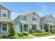 Well-maintained two-story home with blue exterior, front yard landscaping and a welcoming facade at 11288 Listening Dr, Orlando, FL 32832