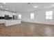 Open-concept living space with tile flooring, seamlessly connecting the kitchen and living area, ideal for entertaining at 11288 Listening Dr, Orlando, FL 32832