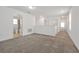 Upstairs loft area with carpet flooring, neutral walls, and lots of natural light at 11288 Listening Dr, Orlando, FL 32832