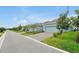 A row of houses along the street with landscaped front yards and driveways at 11288 Listening Dr, Orlando, FL 32832