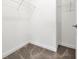 Walk-in closet with carpet flooring, shelving, and a hanging rack at 11288 Listening Dr, Orlando, FL 32832