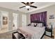 Bedroom with carpet floors, ceiling fan, and an ensuite bathroom at 1210 Quintuplet Dr, Casselberry, FL 32707