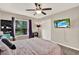 Bedroom featuring carpet floors, a ceiling fan, and TV at 1210 Quintuplet Dr, Casselberry, FL 32707