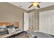 Well-lit bedroom with carpet flooring, ceiling fan, and closet at 1210 Quintuplet Dr, Casselberry, FL 32707