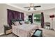 Bedroom with large window, ceiling fan, and carpet flooring at 1210 Quintuplet Dr, Casselberry, FL 32707
