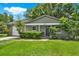 Charming one-story home with lush green lawn and a white garage door at 1210 Quintuplet Dr, Casselberry, FL 32707