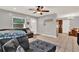 Comfortable living room featuring a large sectional sofa leading to the kitchen at 1210 Quintuplet Dr, Casselberry, FL 32707