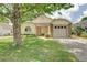 Charming single-story home with a well-manicured lawn and a cozy, welcoming facade at 123 Edgewater Cir, Sanford, FL 32773