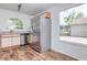 Bright kitchen featuring modern stainless steel appliances and a large window with a scenic view at 123 Edgewater Cir, Sanford, FL 32773