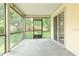 Screened porch with view of green backyard at 123 Edgewater Cir, Sanford, FL 32773
