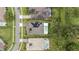 Drone image showing the home's solar panels, pool, green lawns and manicured landscaping at 1265 Estancia Woods Loop, Windermere, FL 34786