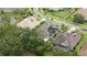 Aerial perspective of a luxury community, highlighting the mature trees, solar and landscaping at 1265 Estancia Woods Loop, Windermere, FL 34786